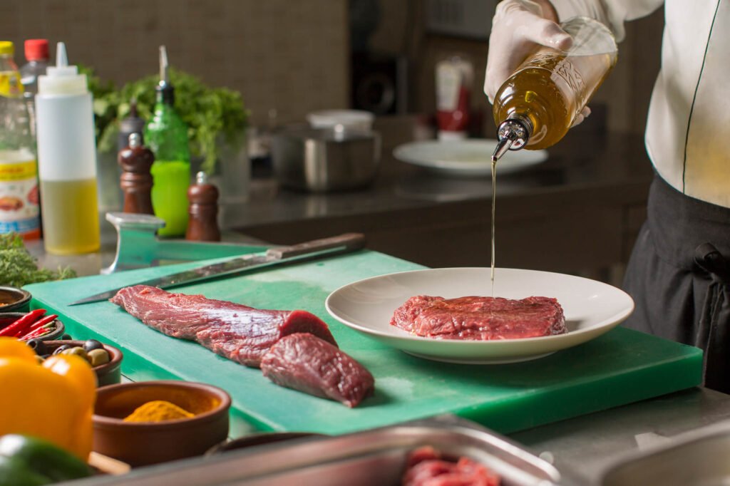 eddy-foods-inc-retailer-chef-steaks Chef preparing a steak bought at an Eddy retailer